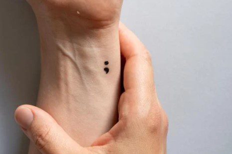 A semicolon tattoo