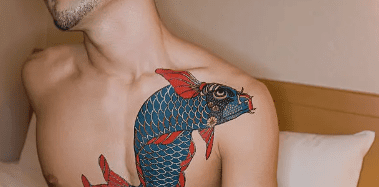 A man with a koi fish tattoo,